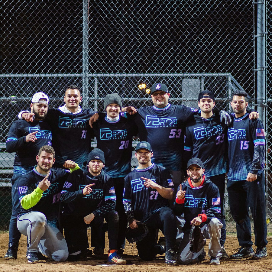 7Bros Apparel softball team in custom black and teal sublimated jerseys under the lights
