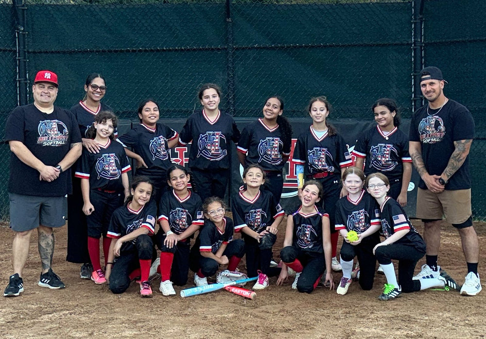 Hillcrest Softball team and coaches in custom black 7Bros jerseys with red, white and blue trim