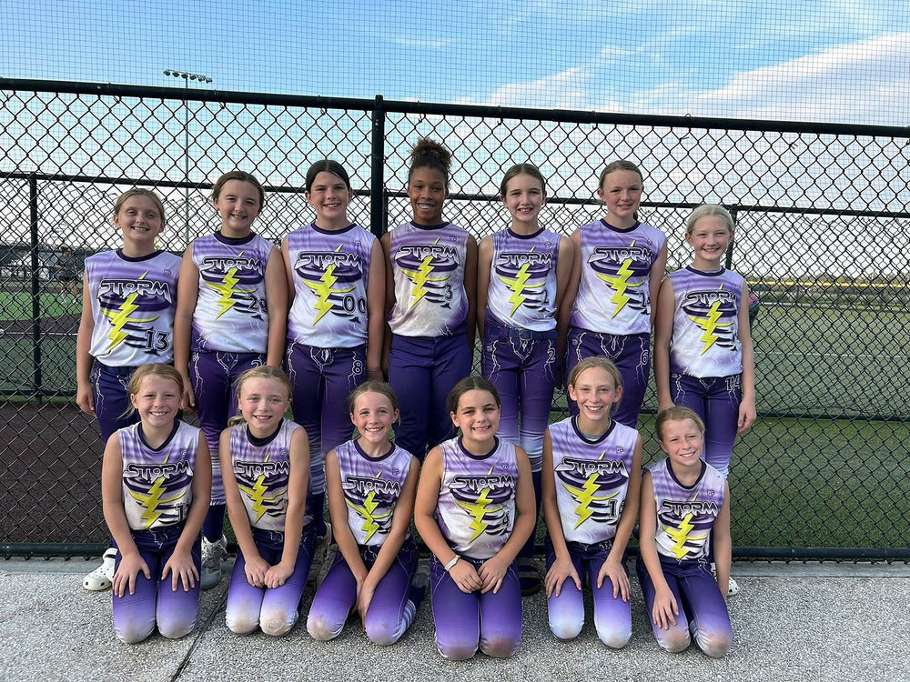 Saluda Storm youth softball team in custom purple and white sublimated lightning jerseys